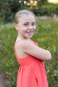 Littleton family photographer Mt. Falcon park Colorado sunset golden hour sisters photography mountain views mother father daughters wildflowers 