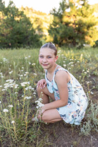 Littleton family photographer Mt. Falcon park Colorado sunset golden hour sisters photography mountain views mother father daughters wildflowers 
