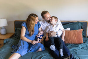 Littleton family and newborn baby photographer Colorado in home lifestyle photography boy parents son brothers