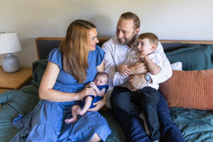 Littleton family and newborn baby photographer Colorado in home lifestyle photography boy parents son brothers