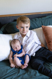 Littleton family and newborn baby photographer Colorado in home lifestyle photography boy parents son brothers