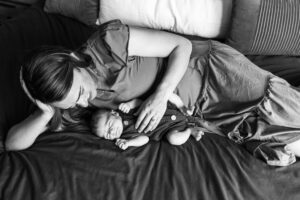 Littleton family and newborn baby photographer Colorado in home lifestyle photography boy parents son brothers mother 