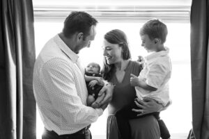 Littleton family and newborn baby photographer Colorado in home lifestyle photography boy parents son brothers