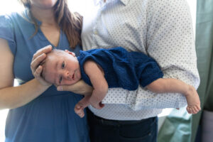 Littleton family and newborn baby photographer Colorado in home lifestyle photography boy parents son brothers