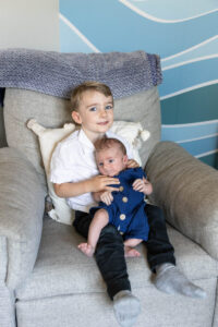 Littleton family and newborn baby photographer Colorado in home lifestyle photography boy parents son brothers