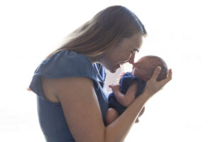 Littleton family and newborn baby photographer Colorado in home lifestyle photography boy parents son brothers