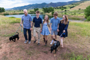 Littleton high school senior photographer South Valley Colorado family photo session portrait Navy siblings red rocks dogs photography sunset cross country track