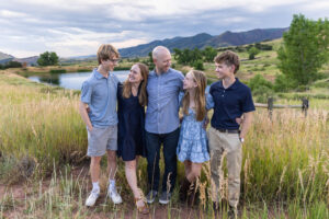 Littleton high school senior photographer South Valley Colorado family photo session portrait Navy siblings red rocks dogs photography sunset cross country track