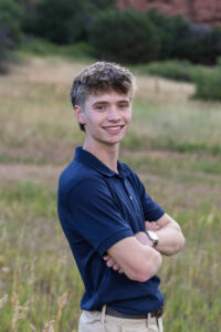 Littleton high school senior photographer South Valley Colorado family photo session portrait Navy siblings red rocks dogs photography sunset cross country track