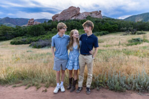Littleton high school senior photographer South Valley Colorado family photo session portrait Navy siblings red rocks dogs photography sunset cross country track