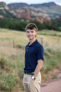 Littleton high school senior photographer South Valley Colorado family photo session portrait Navy siblings red rocks dogs photography sunset cross country track