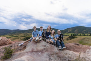 Littleton high school senior photographer South Valley Colorado family photo session portrait Navy siblings red rocks dogs photography sunset cross country track