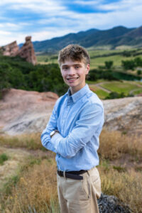 Littleton high school senior photographer South Valley Colorado family photo session portrait Navy siblings red rocks dogs photography sunset cross country track