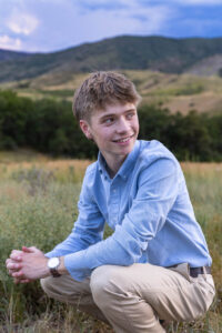 Littleton high school senior photographer South Valley Colorado family photo session portrait Navy siblings red rocks dogs photography sunset cross country track