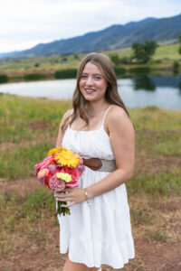 Littleton high school senior photographer Colorado Dakota Ridge class of 2026 nursing student photography South Valley red rocks sunset Writer's Vista park flowers family siblings mother father brother sister daughter son