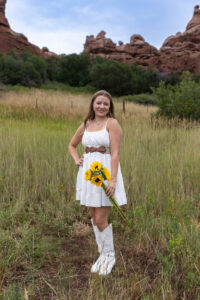 Littleton high school senior photographer Colorado Dakota Ridge class of 2026 nursing student photography South Valley red rocks sunset Writer's Vista park flowers family siblings mother father brother sister daughter son