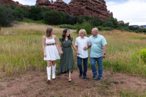 Littleton high school senior photographer Colorado Dakota Ridge class of 2026 nursing student photography South Valley red rocks sunset Writer's Vista park flowers family siblings mother father brother sister daughter son