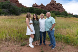 Littleton high school senior photographer Colorado Dakota Ridge class of 2026 nursing student photography South Valley red rocks sunset Writer's Vista park flowers family siblings mother father brother sister daughter son