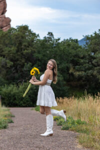 Littleton high school senior photographer Colorado Dakota Ridge class of 2026 nursing student photography South Valley red rocks sunset Writer's Vista park flowers family siblings mother father brother sister daughter son