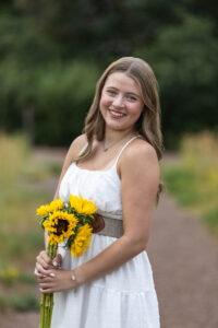 Littleton high school senior photographer Colorado Dakota Ridge class of 2026 nursing student photography South Valley red rocks sunset Writer's Vista park flowers family siblings mother father brother sister daughter son