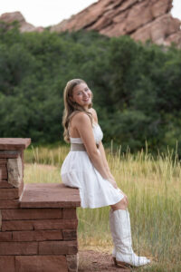 Littleton high school senior photographer Colorado Dakota Ridge class of 2026 nursing student photography South Valley red rocks sunset Writer's Vista park flowers family siblings mother father brother sister daughter son