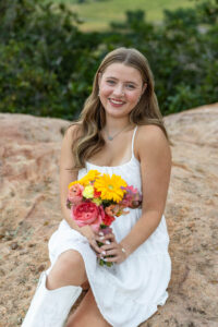 Littleton high school senior photographer Colorado Dakota Ridge class of 2026 nursing student photography South Valley red rocks sunset Writer's Vista park flowers family siblings mother father brother sister daughter son