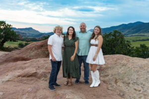 Littleton high school senior photographer Colorado Dakota Ridge class of 2026 nursing student photography South Valley red rocks sunset Writer's Vista park flowers family siblings mother father brother sister daughter son