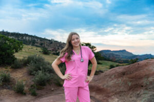 Littleton high school senior photographer Colorado Dakota Ridge class of 2026 nursing student photography South Valley red rocks sunset Writer's Vista park flowers family siblings mother father brother sister daughter son stethoscope scrubs
