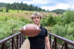 Littleton high school senior photographer Colorado Lair o' the Bear park South Valley photography sunset foothills football player Chatfield student class of 2026 teen teenager boy