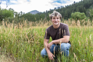 Littleton high school senior photographer Colorado Lair o' the Bear park South Valley photography sunset foothills football player Chatfield student class of 2026 teen teenager boy