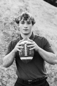 Littleton high school senior photographer Colorado Lair o' the Bear park South Valley photography sunset foothills football player Chatfield student class of 2026 teen teenager boy