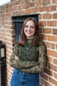 Littleton high school senior photographer teenager Downtown Morrison urban Lair O' the Bear Park nature water river bridge sabre sword flag team photography sunset Colorado foothills