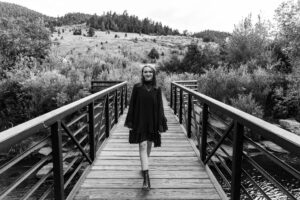Littleton high school senior photographer teenager Downtown Morrison urban Lair O' the Bear Park nature water river bridge sabre sword flag team photography sunset Colorado foothills