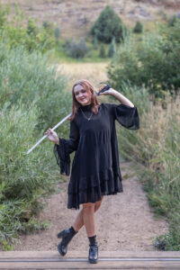 Littleton high school senior photographer teenager Downtown Morrison urban Lair O' the Bear Park nature water river bridge saber sword flag team color guard photography sunset Colorado foothills