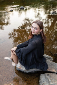 Littleton high school senior photographer teenager Downtown Morrison urban Lair O' the Bear Park nature water river bridge sabre sword flag team photography sunset Colorado foothills