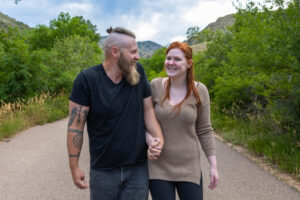 Littleton engagement photographer wedding marriage engaged couple in love future bride and groom Morrison park river water red rocks Mt. Falcon photography Colorado Wisconsin ring summer