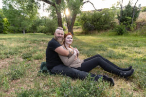 Littleton engagement photographer wedding marriage engaged couple in love future bride and groom Morrison park river water red rocks Mt. Falcon photography Colorado Wisconsin ring summer