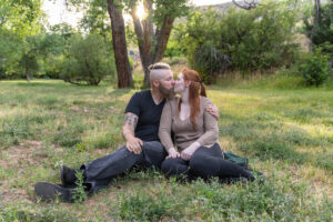 Littleton engagement photographer wedding marriage engaged couple in love future bride and groom Morrison park river water red rocks Mt. Falcon photography Colorado Wisconsin ring summer