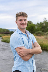 Littleton high school senior photographer Carson Nature Center Colorado lacrosse player Dakota Ridge teenager boy teen sunset bridge friend