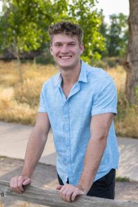 Littleton high school senior photographer Carson Nature Center Colorado lacrosse player Dakota Ridge teenager boy teen sunset bridge friend