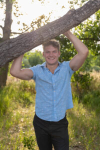 Littleton high school senior photographer Carson Nature Center Colorado lacrosse player Dakota Ridge teenager boy teen sunset bridge friend