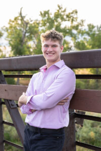 Littleton high school senior photographer Carson Nature Center Colorado lacrosse player Dakota Ridge teenager boy teen sunset bridge friend