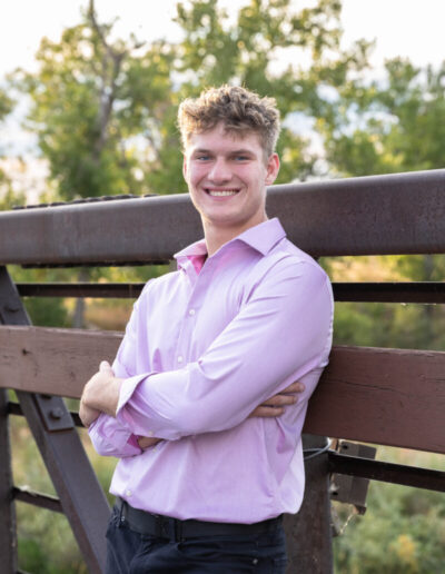 Littleton high school senior photographer Carson Nature Center Colorado lacrosse player Dakota Ridge teenager boy teen sunset bridge friend