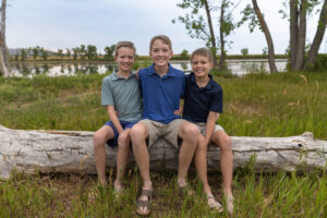 Littleton family photographer Harriman Lake Lakewood Colorado foothills water photography boys brothers parents mountain views sunset
