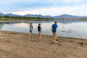 Littleton family photographer Harriman Lake Lakewood Colorado foothills water photography boys brothers parents mountain views sunset