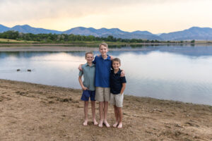 Littleton family photographer Harriman Lake Lakewood Colorado foothills water photography boys brothers parents mountain views sunset