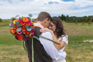Littleton wedding photographer Colorado bride and groom marriage married flowers bouquet photography ring husband wife