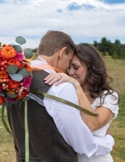 Littleton wedding photographer Colorado bride and groom marriage married flowers bouquet photography ring husband wife