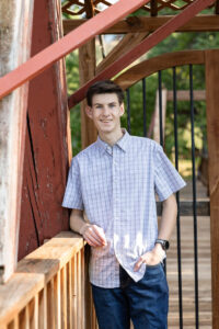 Littleton high school senior photographer Colorado Chatfield cross country Morrison photography water river bridge engineering family sister brother dog sunset