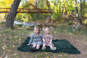 Littleton family photographer mini sessions Morrison Park fall photography Colorado dogs puppies couples mother father kids children siblings bridge river color brother sister baby